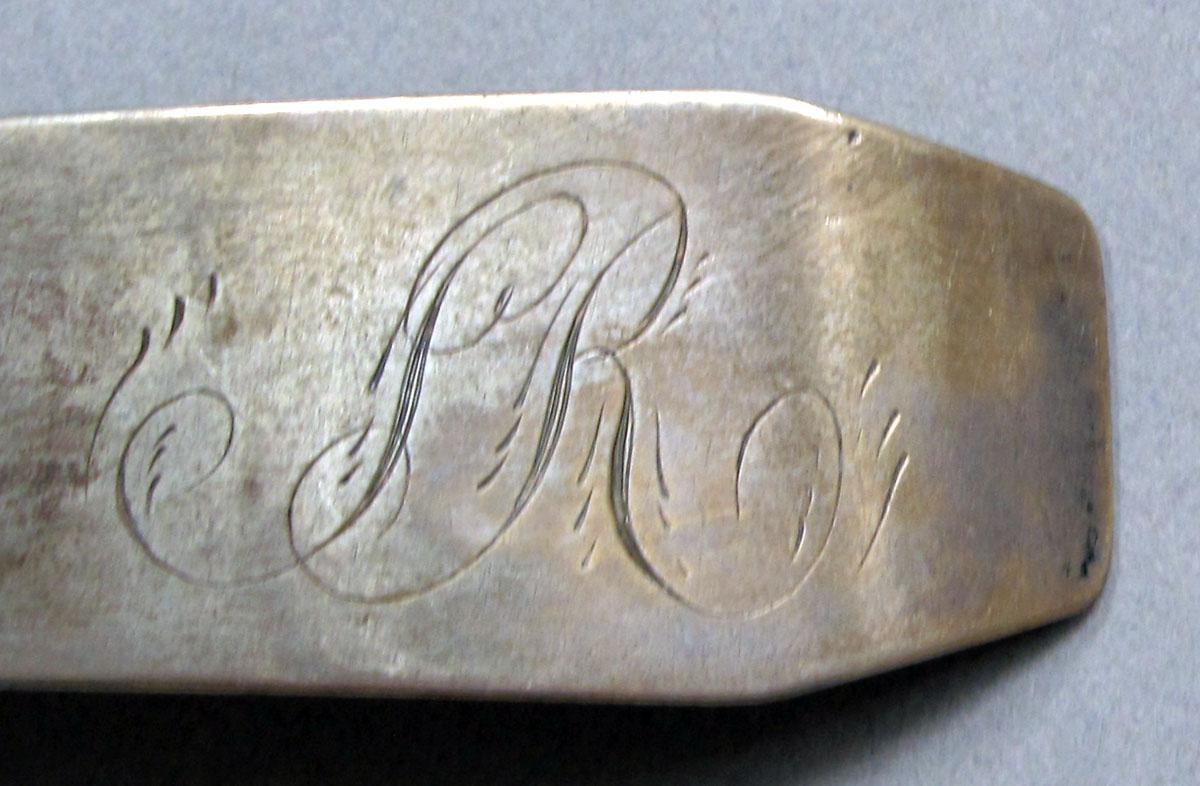 1962.0240.1049 Silver spoon engraving