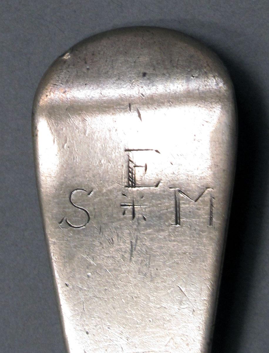 1962.0240.1050 Silver spoon engraving