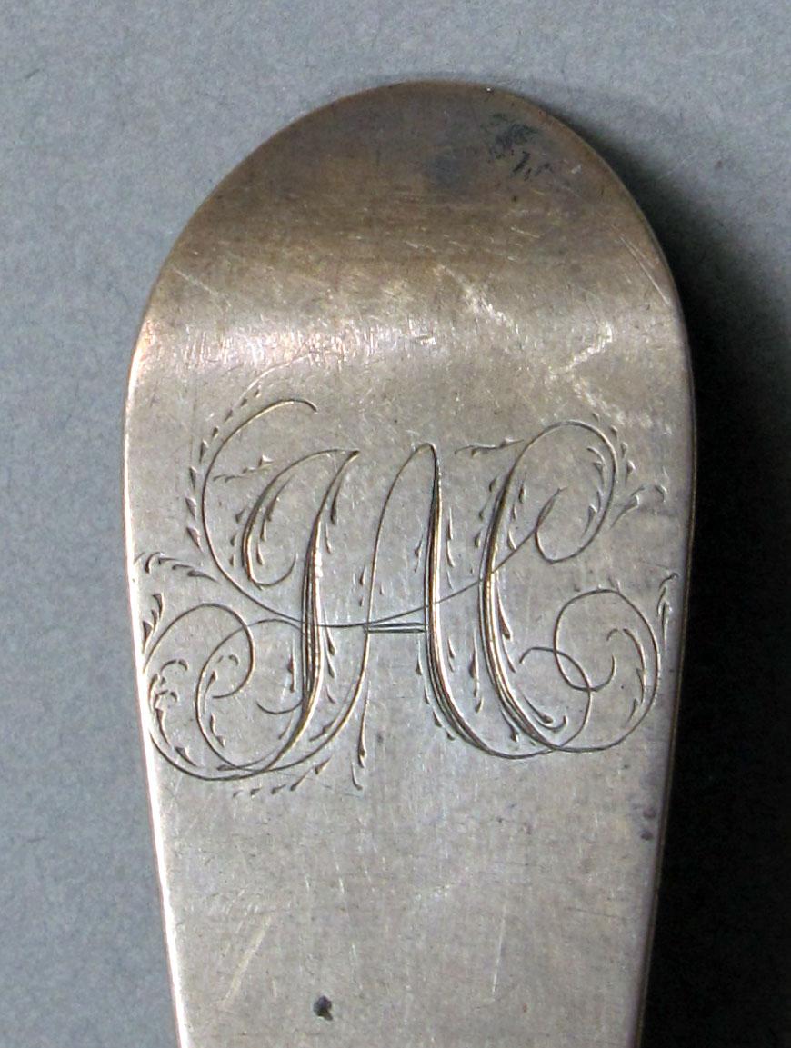 1962.0240.1052 Silver spoon engraving