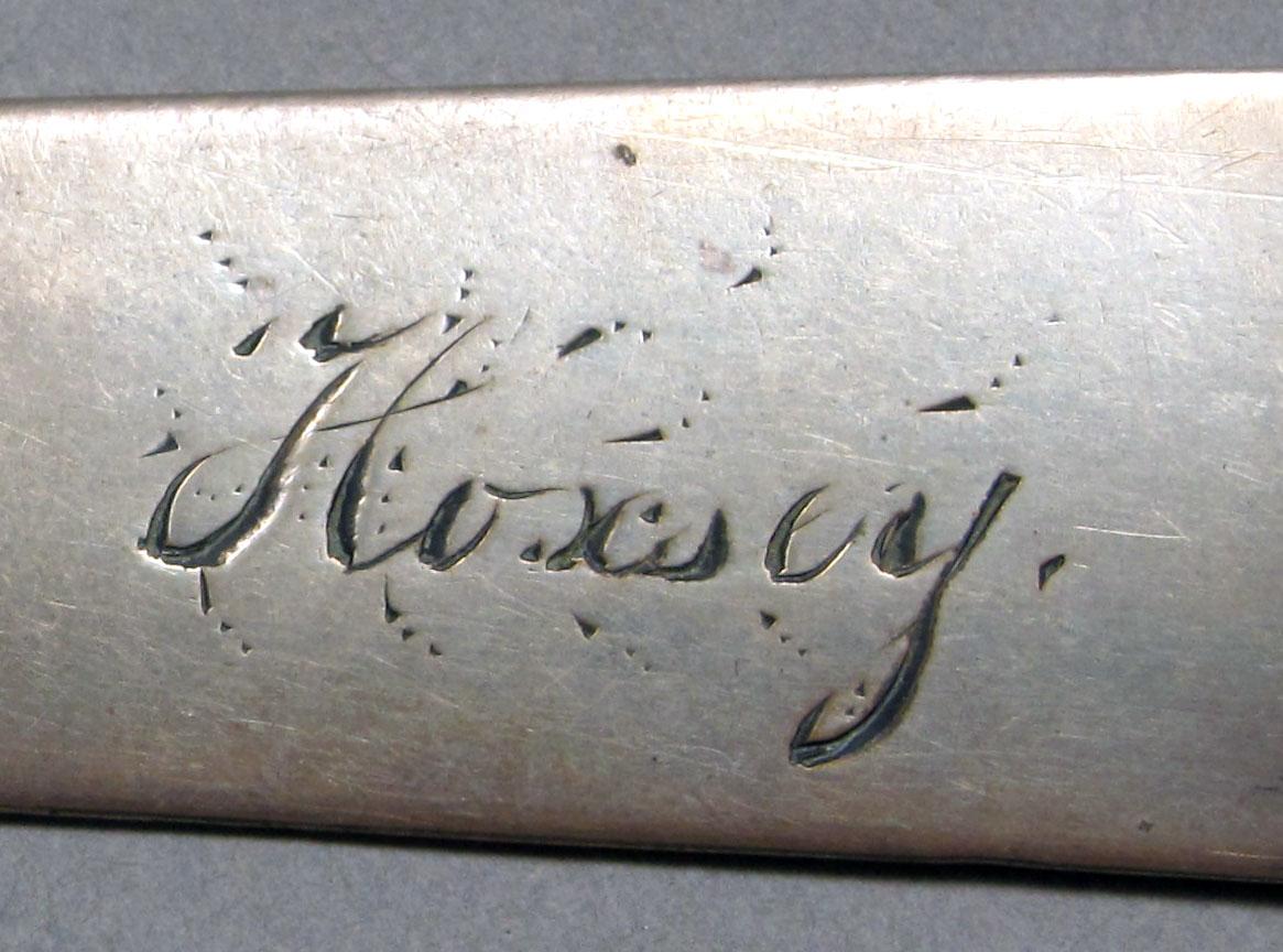 1962.0240.1053 Silver spoon engraving 2