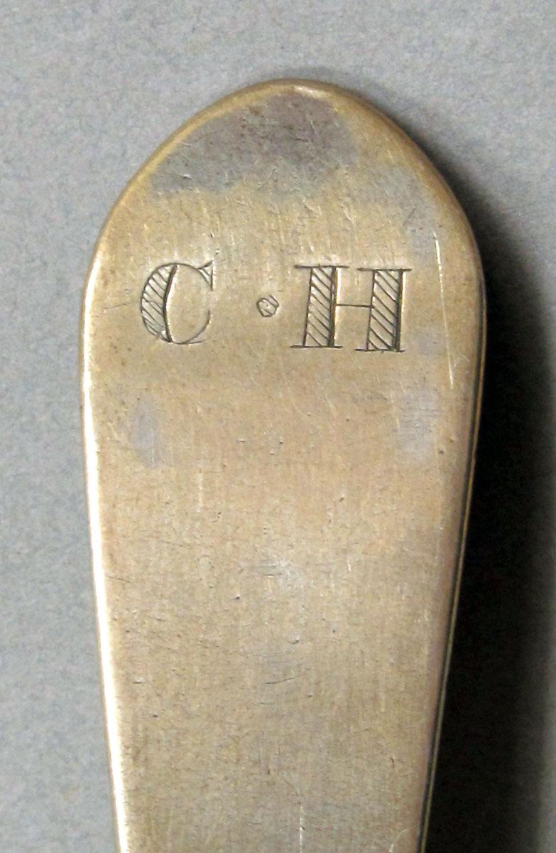 1962.0240.1055 Silver spoon engraving