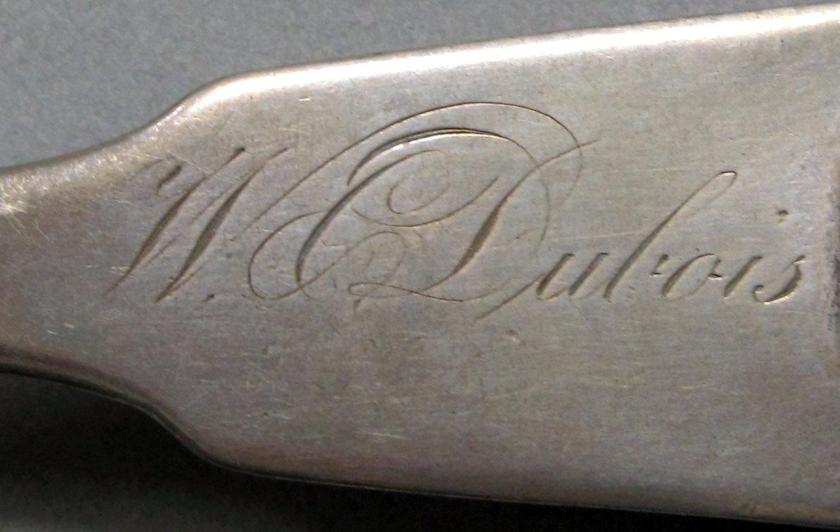 1962.0240.1056 Silver spoon engraving