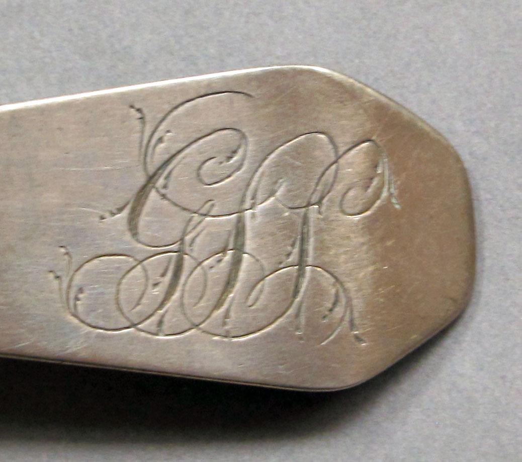 1962.0240.1057 Silver spoon engraving