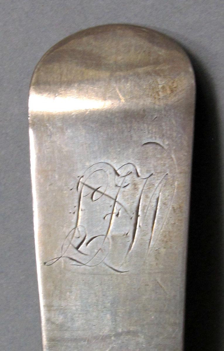 1962.0240.1058 Silver spoon engraving
