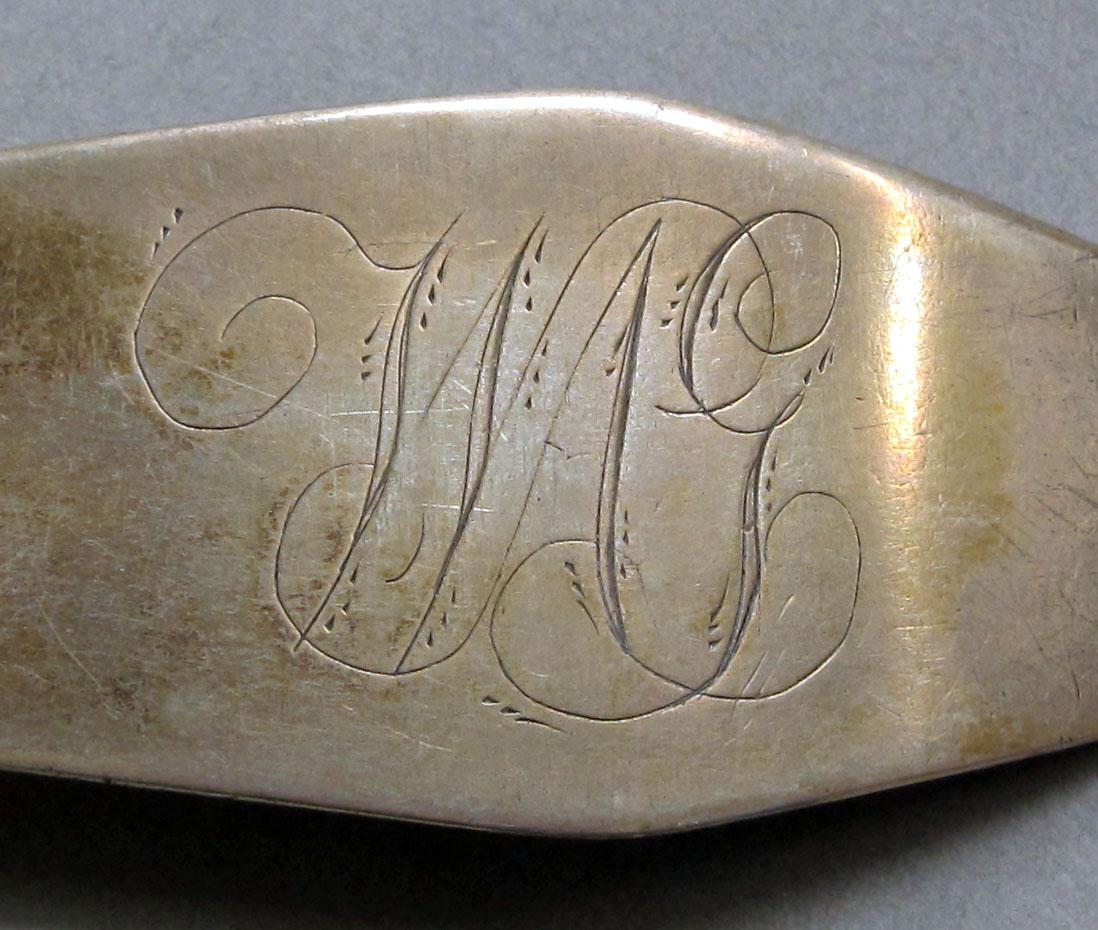 1962.0240.1060 Silver spoon engraving
