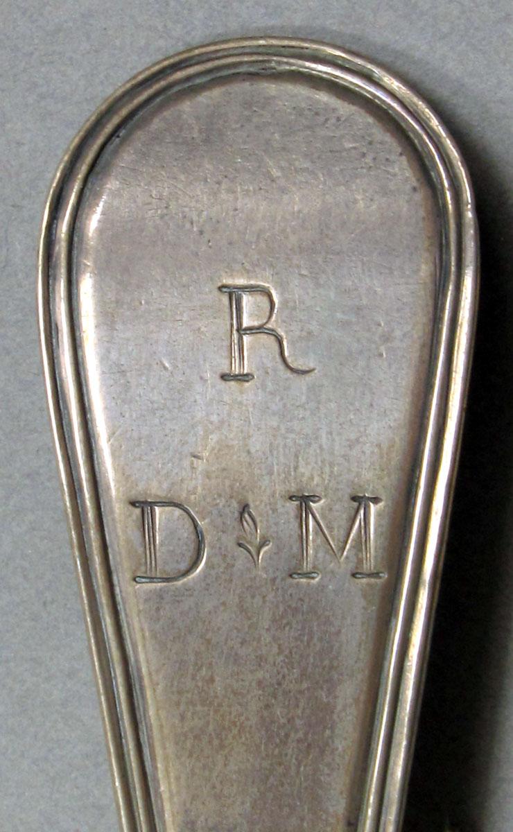 1962.0240.1063 Silver spoon engraving