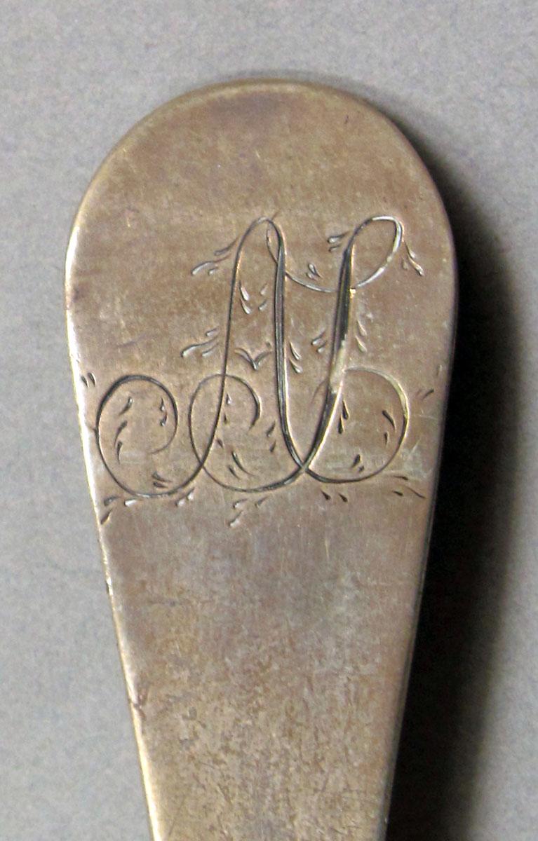 1962.0240.1064 Silver spoon engraving