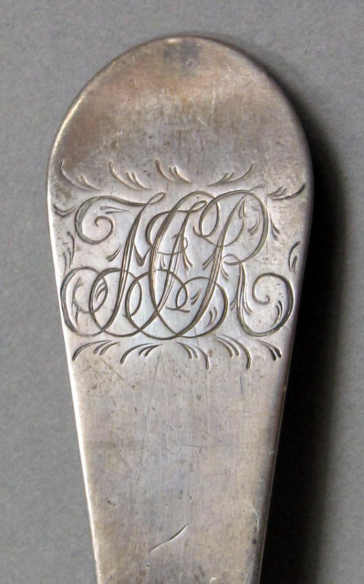 1962.0240.1066 Silver spoon engraving