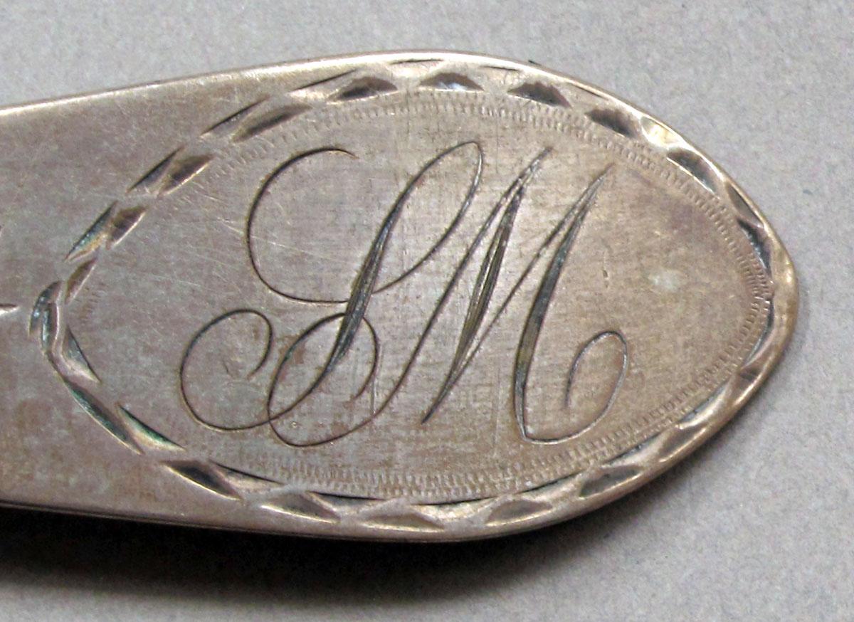 1962.0240.1068.001 Silver spoon engraving