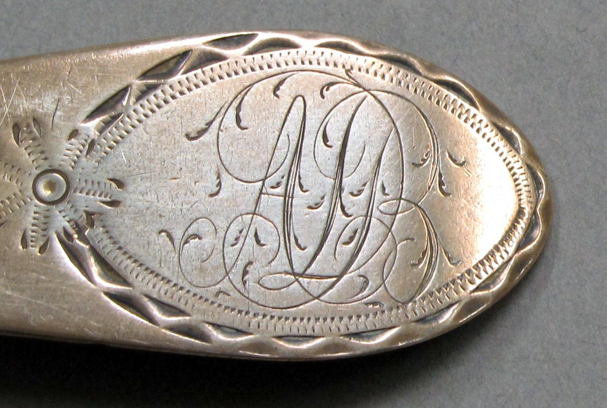 1962.0240.1069 Silver spoon engraving