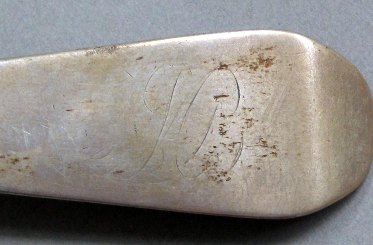 1962.0240.1072 Silver spoon engraving