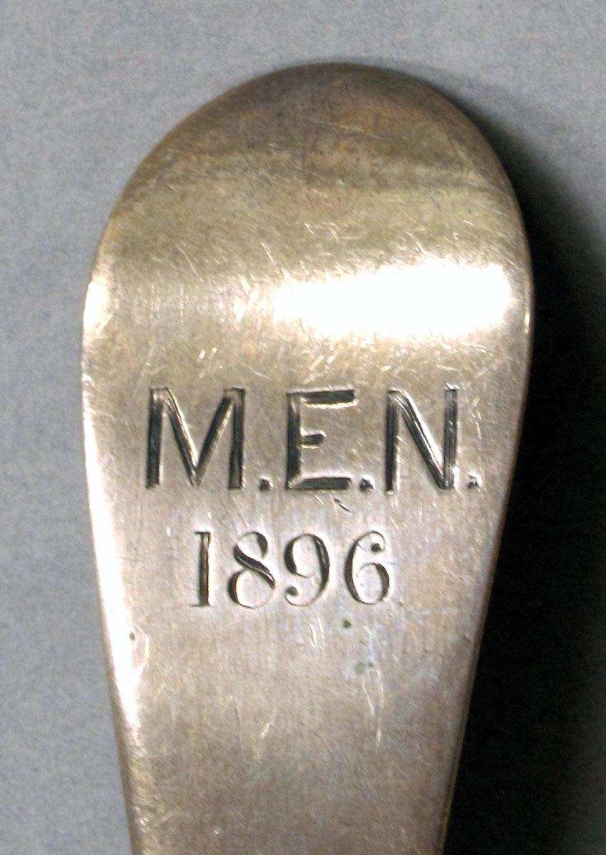 1962.0240.1074 Silver spoon engraving