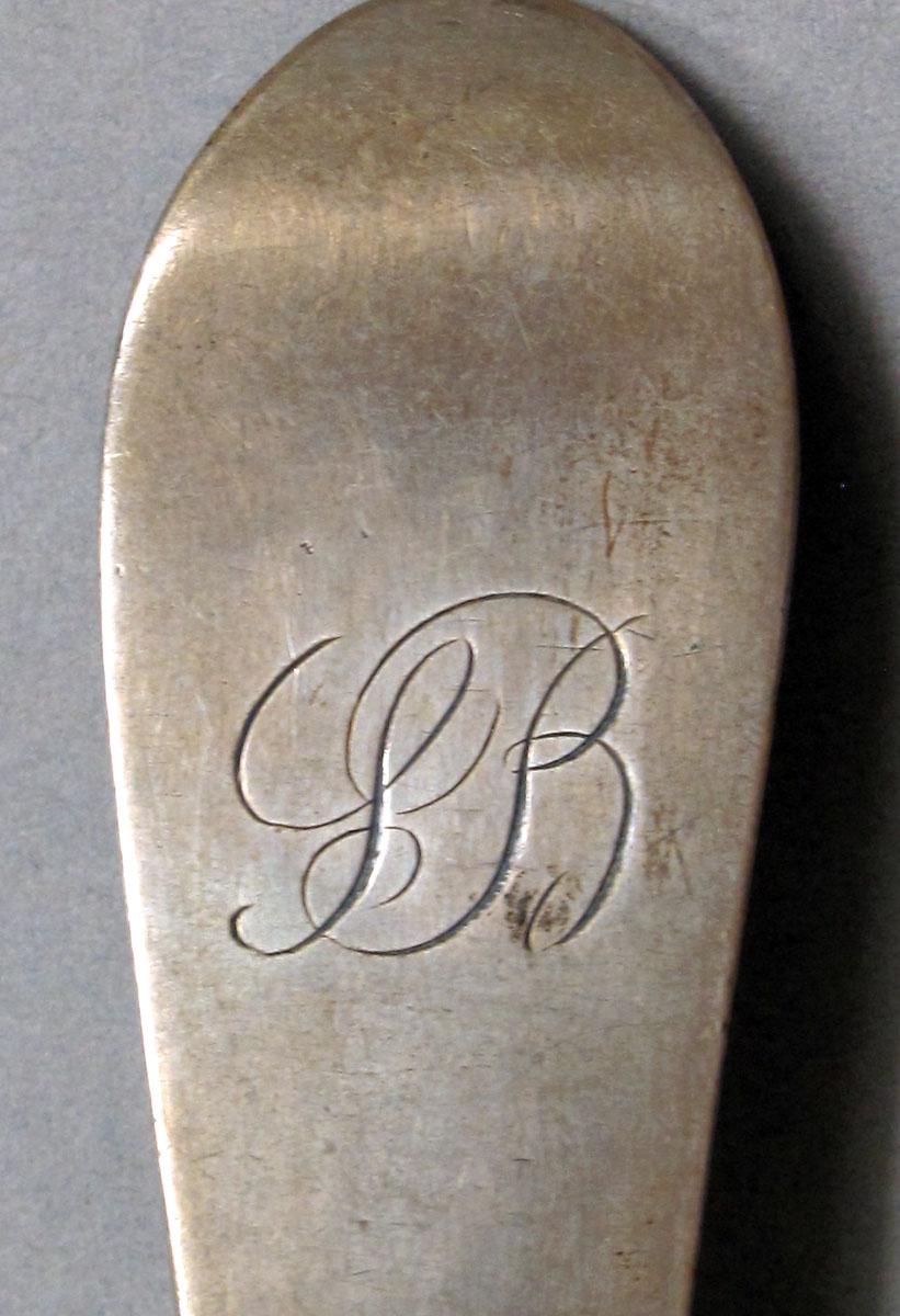1962.0240.1079 Silver spoon engraving