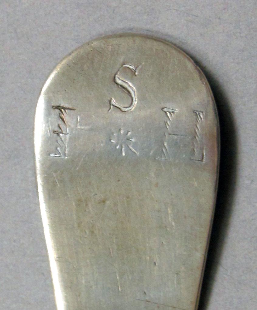 1962.0240.1081 Silver spoon engraving