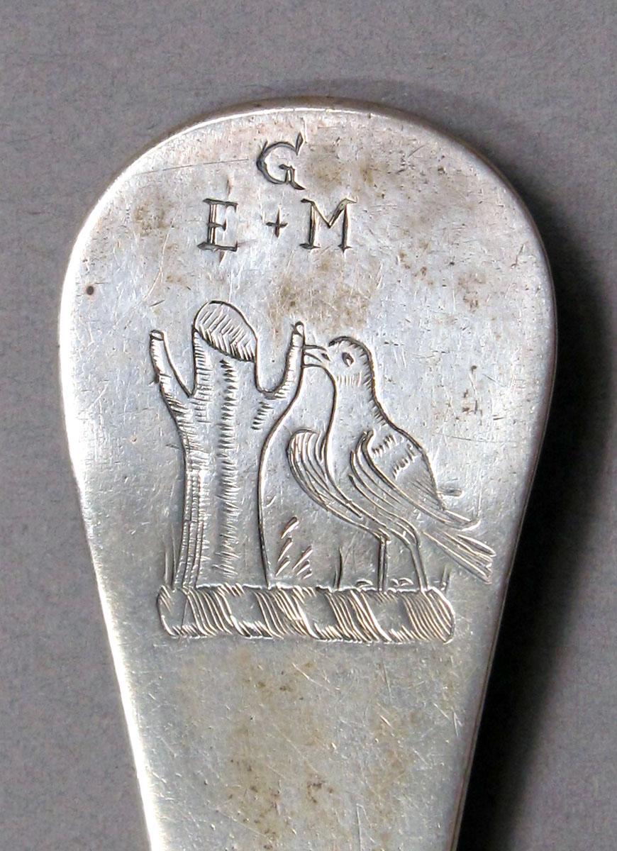 1962.0240.1084 Silver spoon engraving