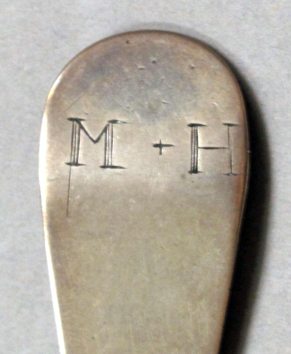1962.0240.1085 Silver spoon engraving