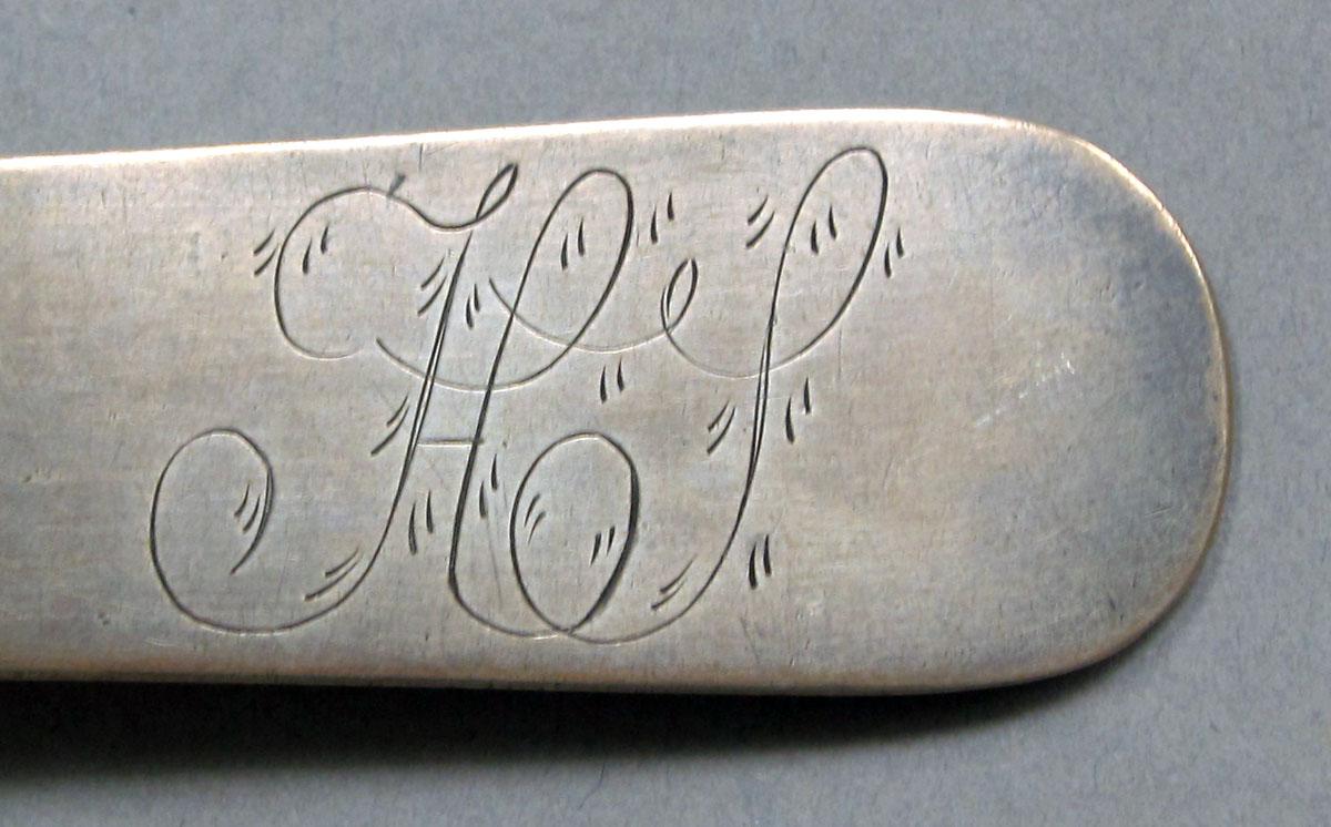 1962.0240.1095 Silver spoon engraving