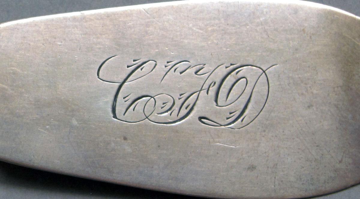 1962.0240.1096 Silver spoon engraving