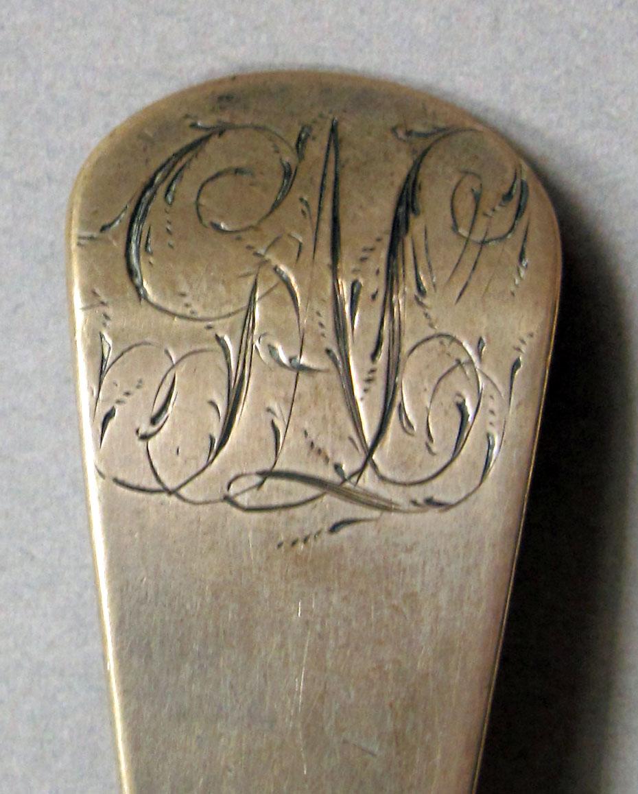 1962.0240.1098 Silver spoon engraving