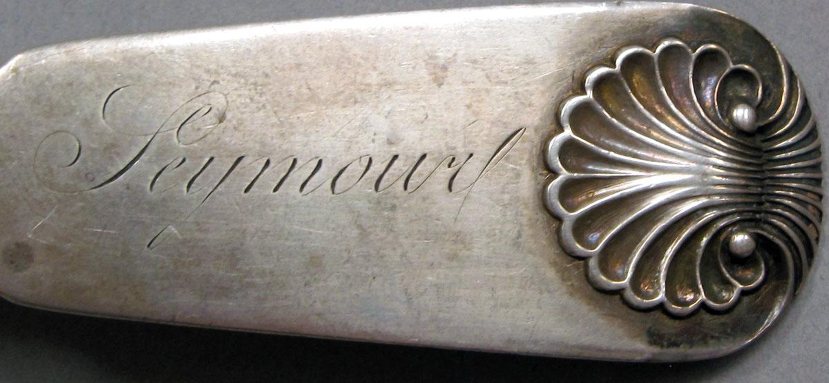 1962.0240.1099 Silver spoon engraving