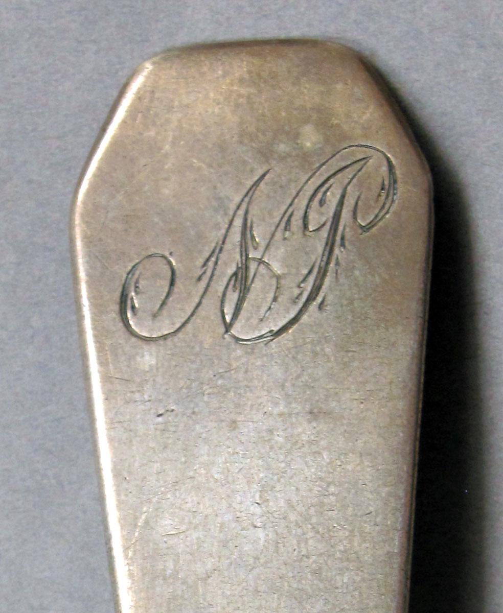 1962.0240.1105 Silver spoon engraving