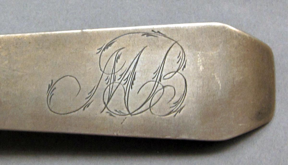1962.0240.1107 Silver spoon engraving