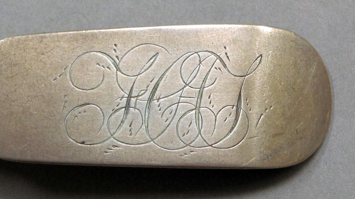 1962.0240.1110 Silver spoon engraving