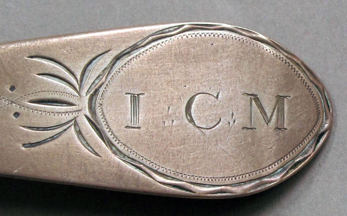 1962.0240.1112 Silver spoon engraving