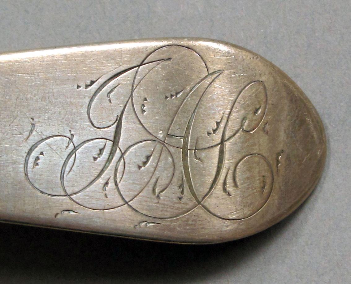 1962.0240.1113 Silver spoon engraving
