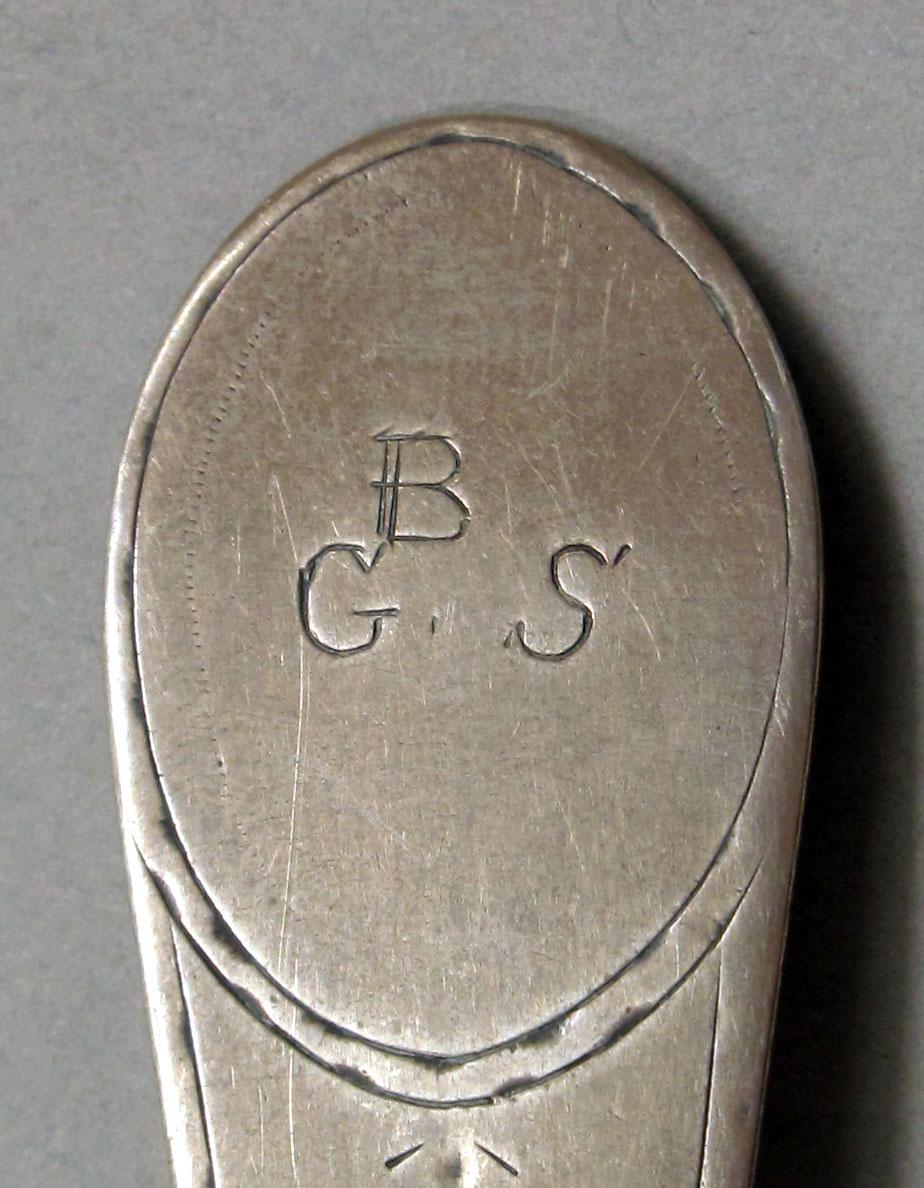 1962.0240.1114 Silver spoon engraving