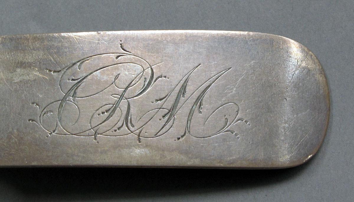1962.0240.1116 Silver spoon engraving