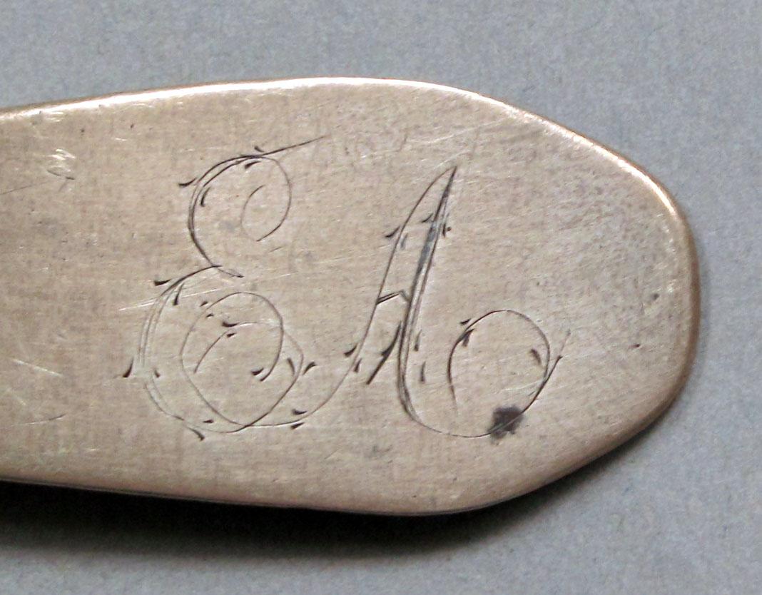 1962.0240.1117 Silver spoon engraving