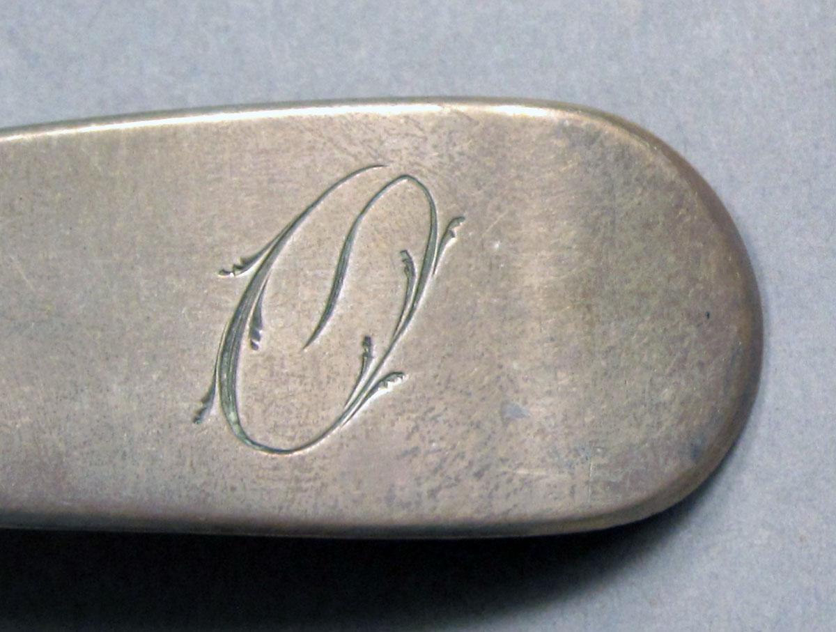 1962.0240.1118 Silver spoon engraving
