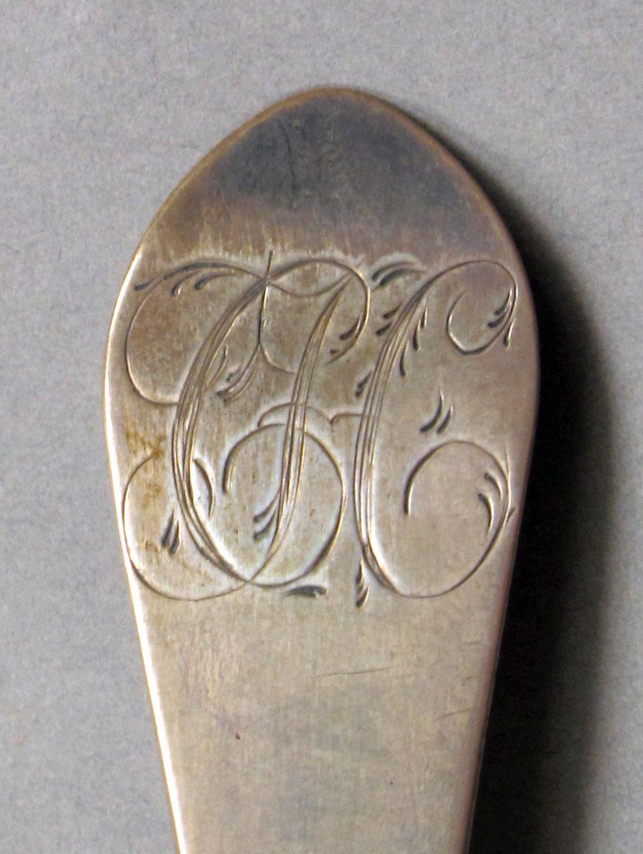 1962.0240.1122 Silver spoon engraving