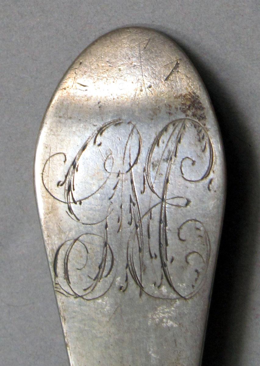 1962.0240.1124 Silver spoon engraving
