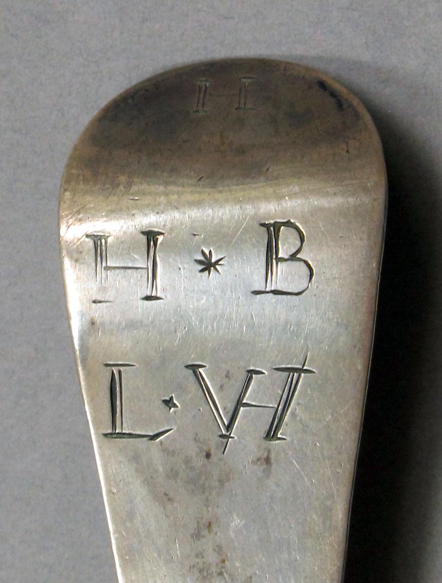 1962.0240.1129 Silver spoon engraving