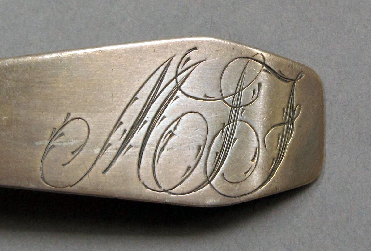 1962.0240.1130 Silver spoon engraving