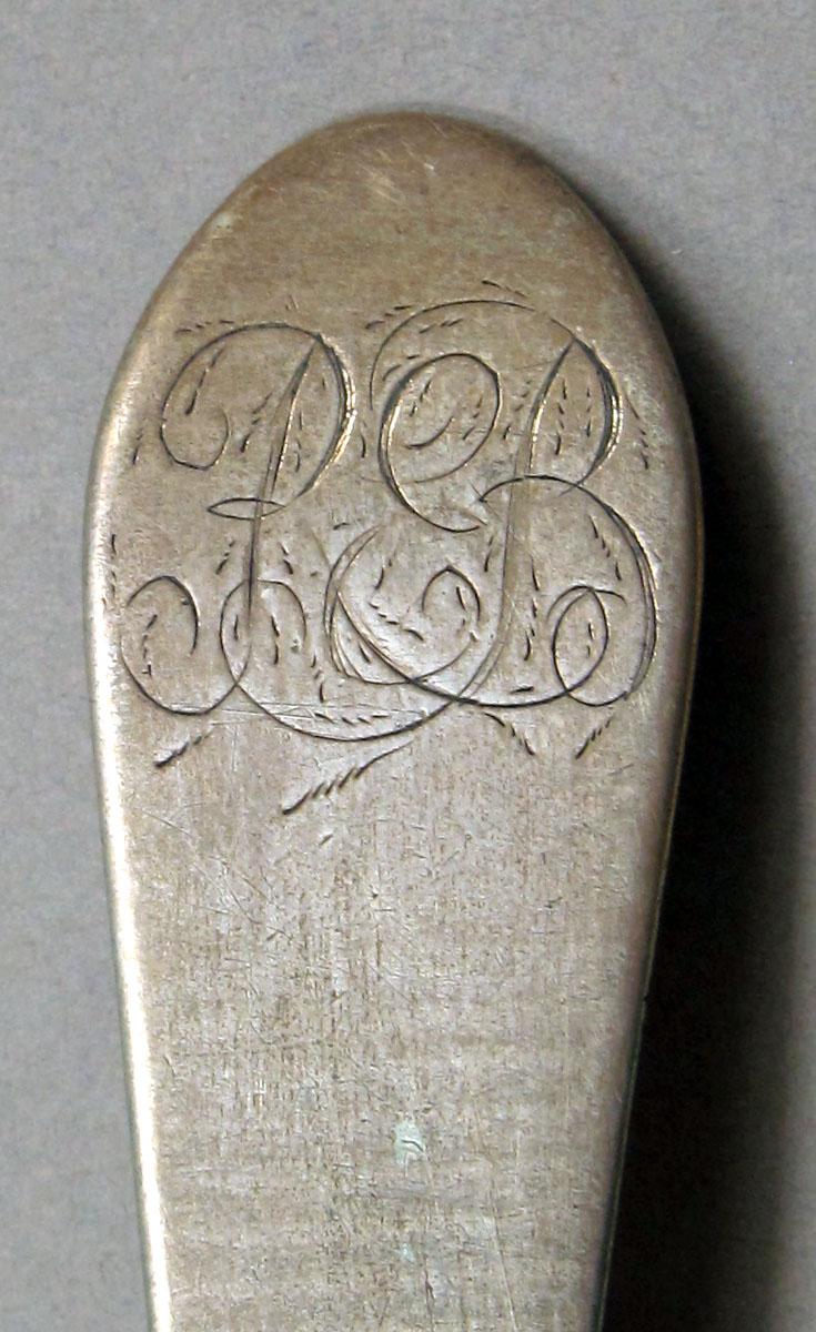 1962.0240.1132 Silver spoon engraving