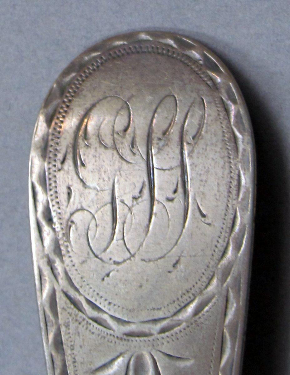 1962.0240.1133 Silver spoon engraving