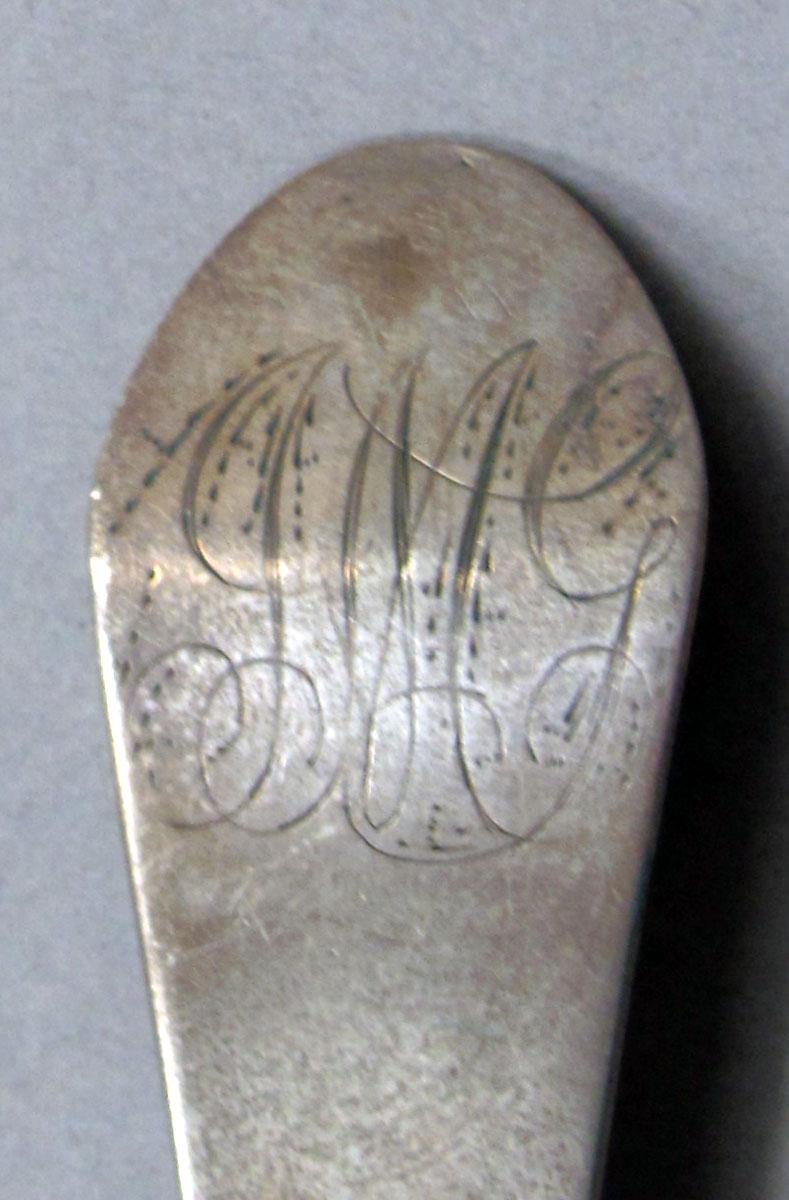 1962.0240.1134 Silver spoon engraving