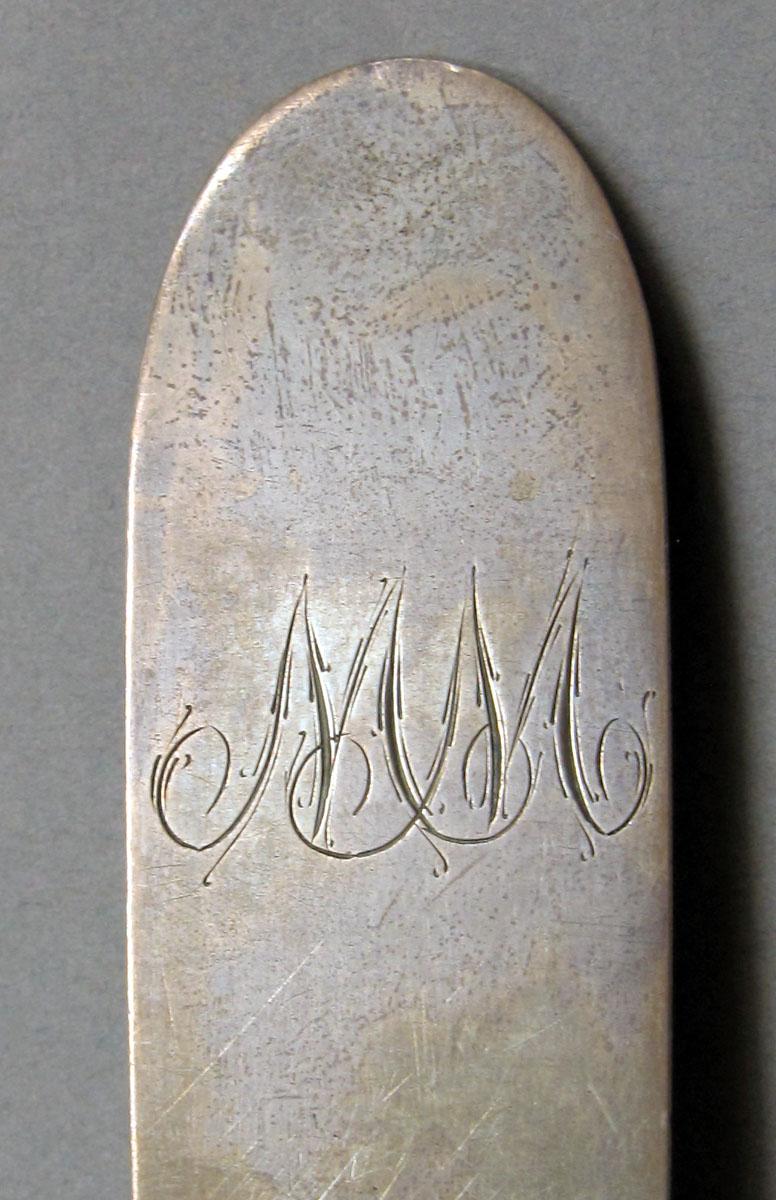 1962.0240.1135 Silver spoon engraving