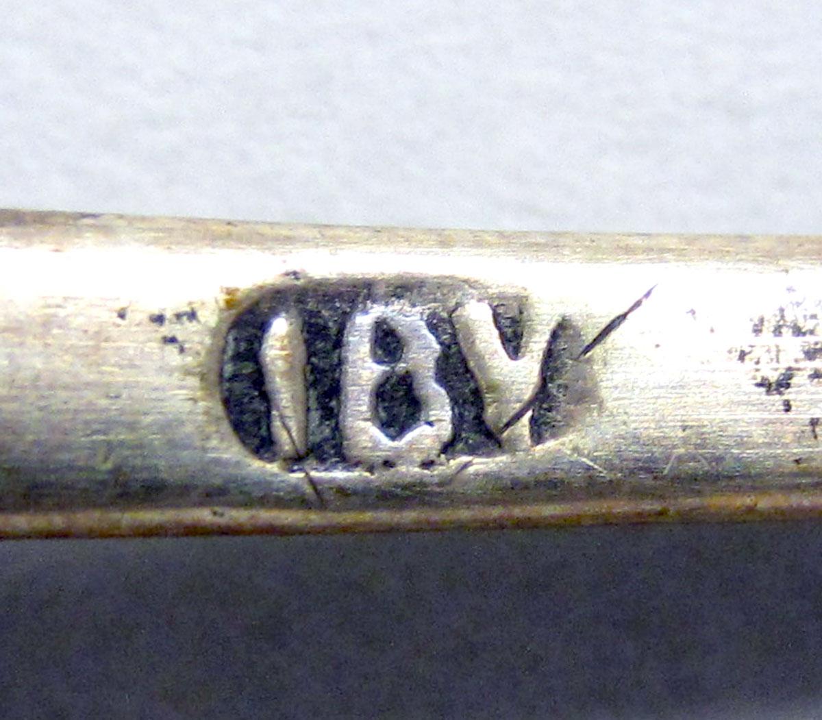 1962.0240.113 teaspoon mark