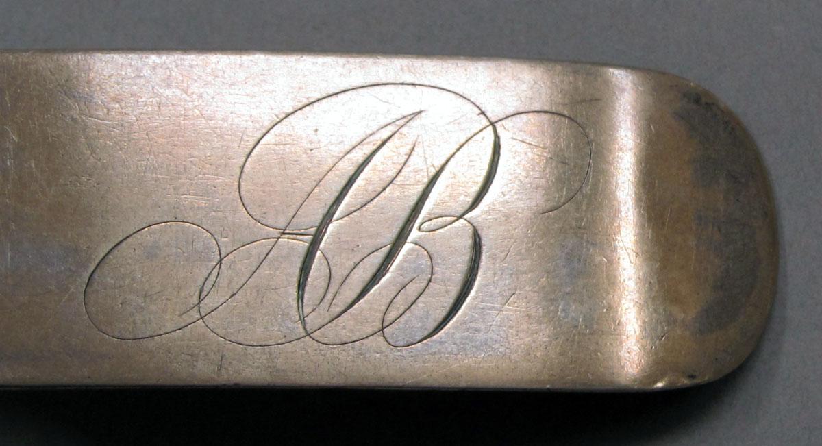 1962.0240.1143 Silver spoon engraving