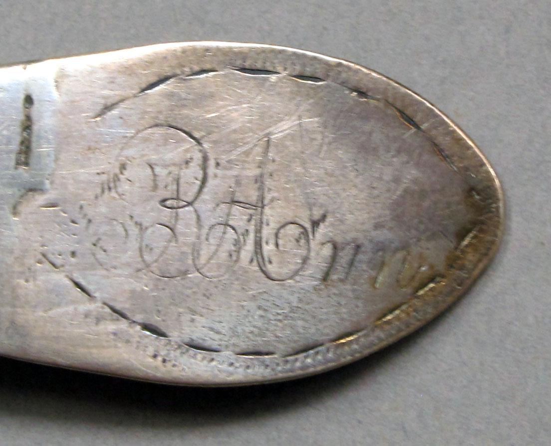 1962.0240.1144 Silver spoon engraving