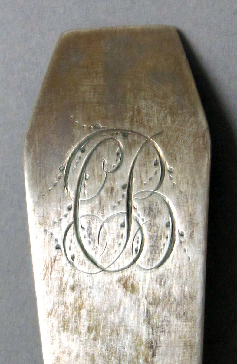 1962.0240.1184 Silver spoon engraving
