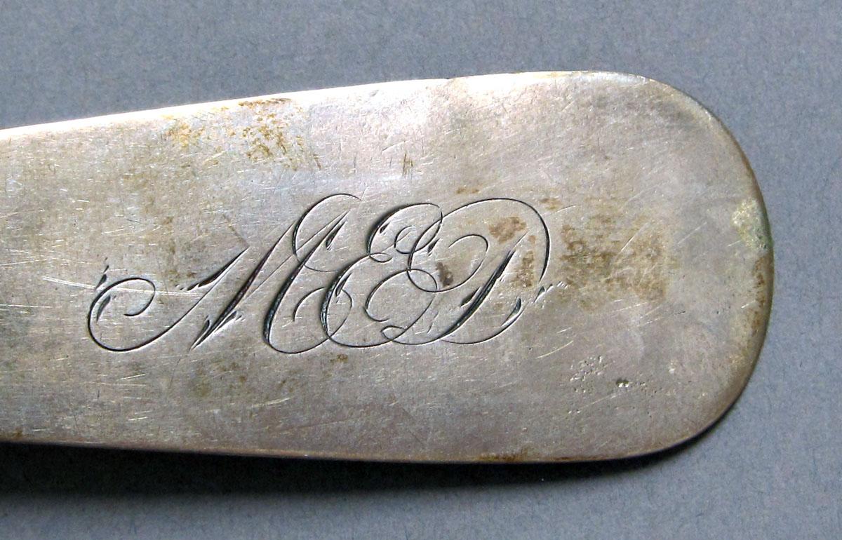 1962.0240.1186 Silver spoon engraving