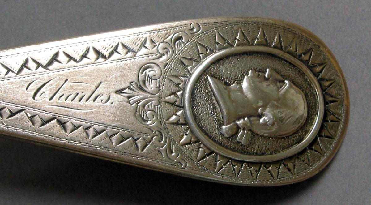 1962.0240.1188.001 Silver spoon engraving
