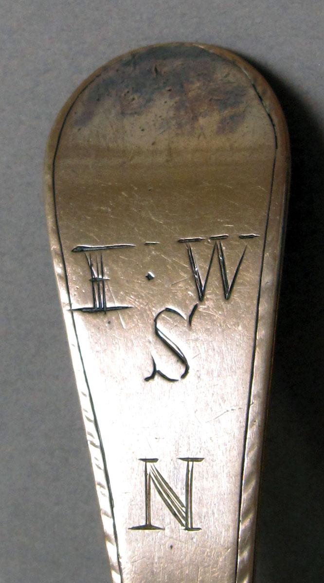 1962.0240.1198 Silver spoon engraving