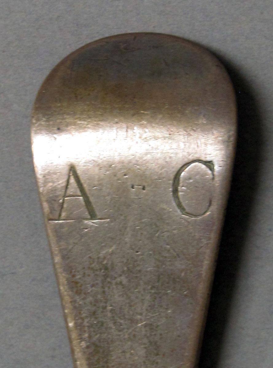 1962.0240.1206 Silver spoon engraving
