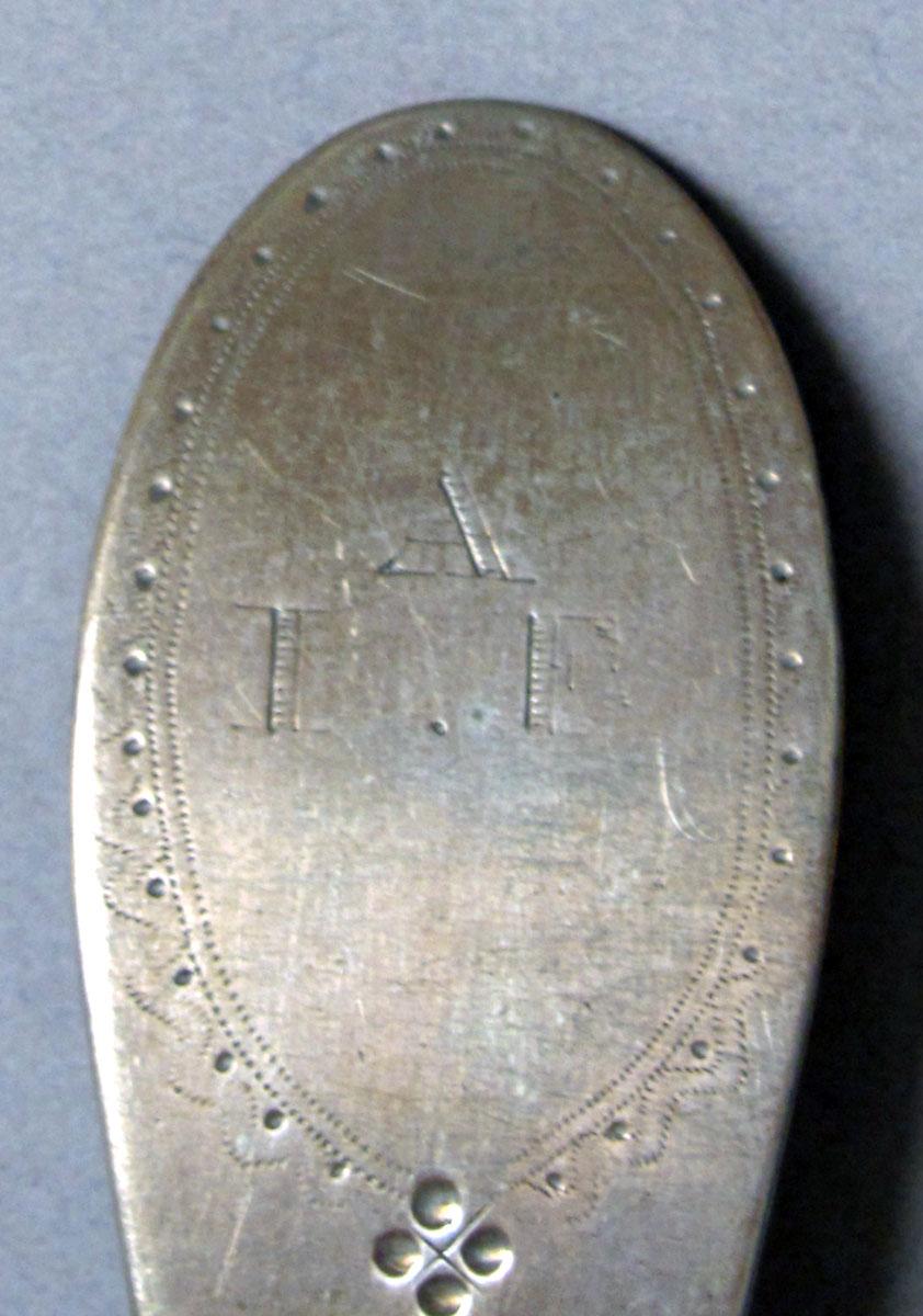 1962.0240.1208 Silver spoon engraving